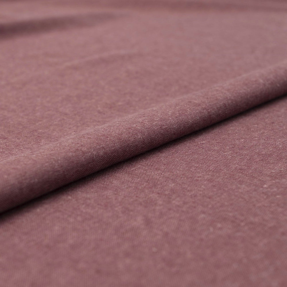 Close-up of Linen/Rayon Yarn Dye fabric in plum color showing textured yarn-dyed pattern and rich color variation.

