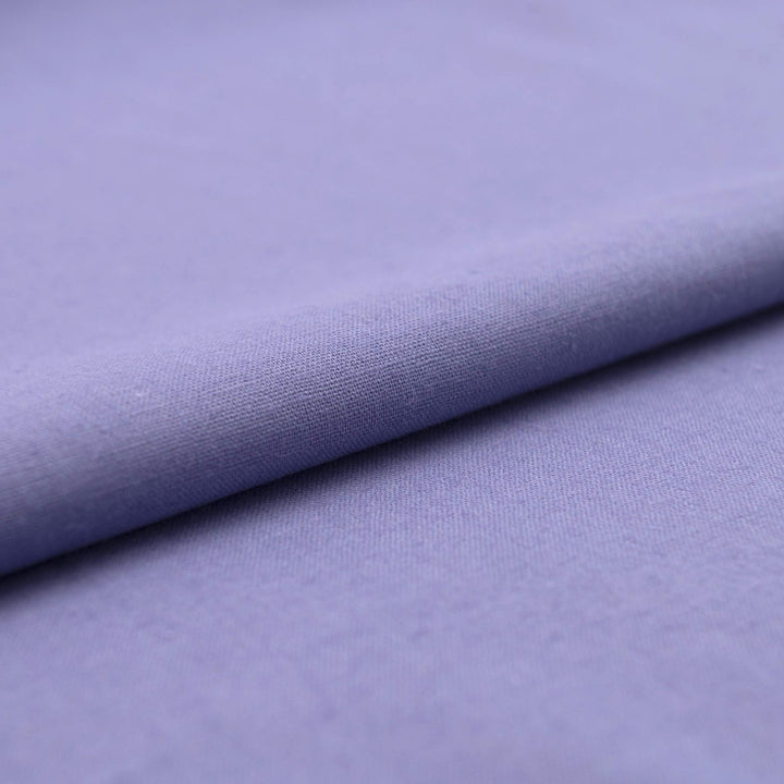 Lavender linen and cotton blend fabric, mid-weight, breathable, and opaque, with a soft drape ideal for sewing dresses, tunics, pants, and shirts.

