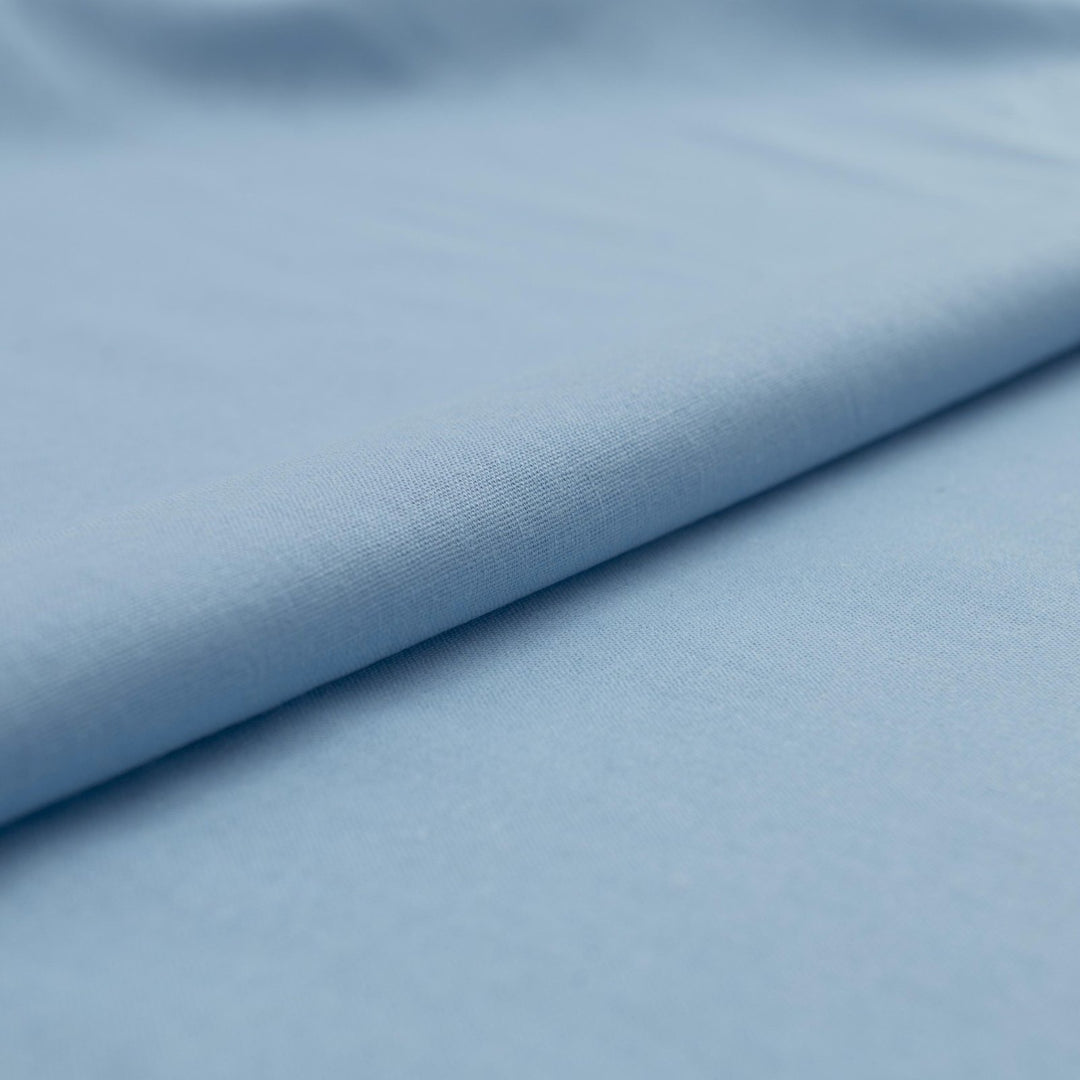 Pale blue linen and cotton blend fabric, mid-weight, soft, breathable, and opaque, perfect for sewing dresses, shirts, pants, and lightweight jackets.

