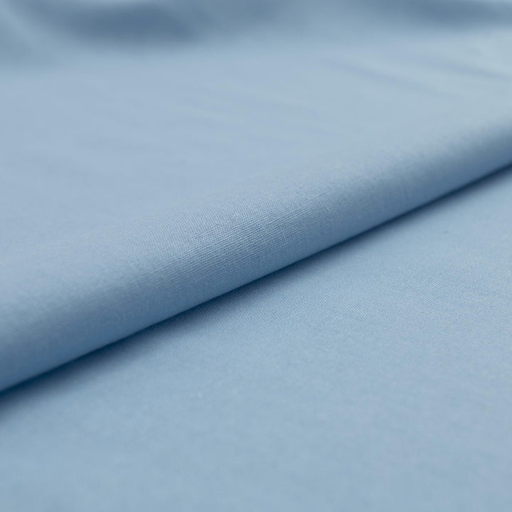Pale blue linen and cotton blend fabric, mid-weight, soft, breathable, and opaque, perfect for sewing dresses, shirts, pants, and lightweight jackets.

