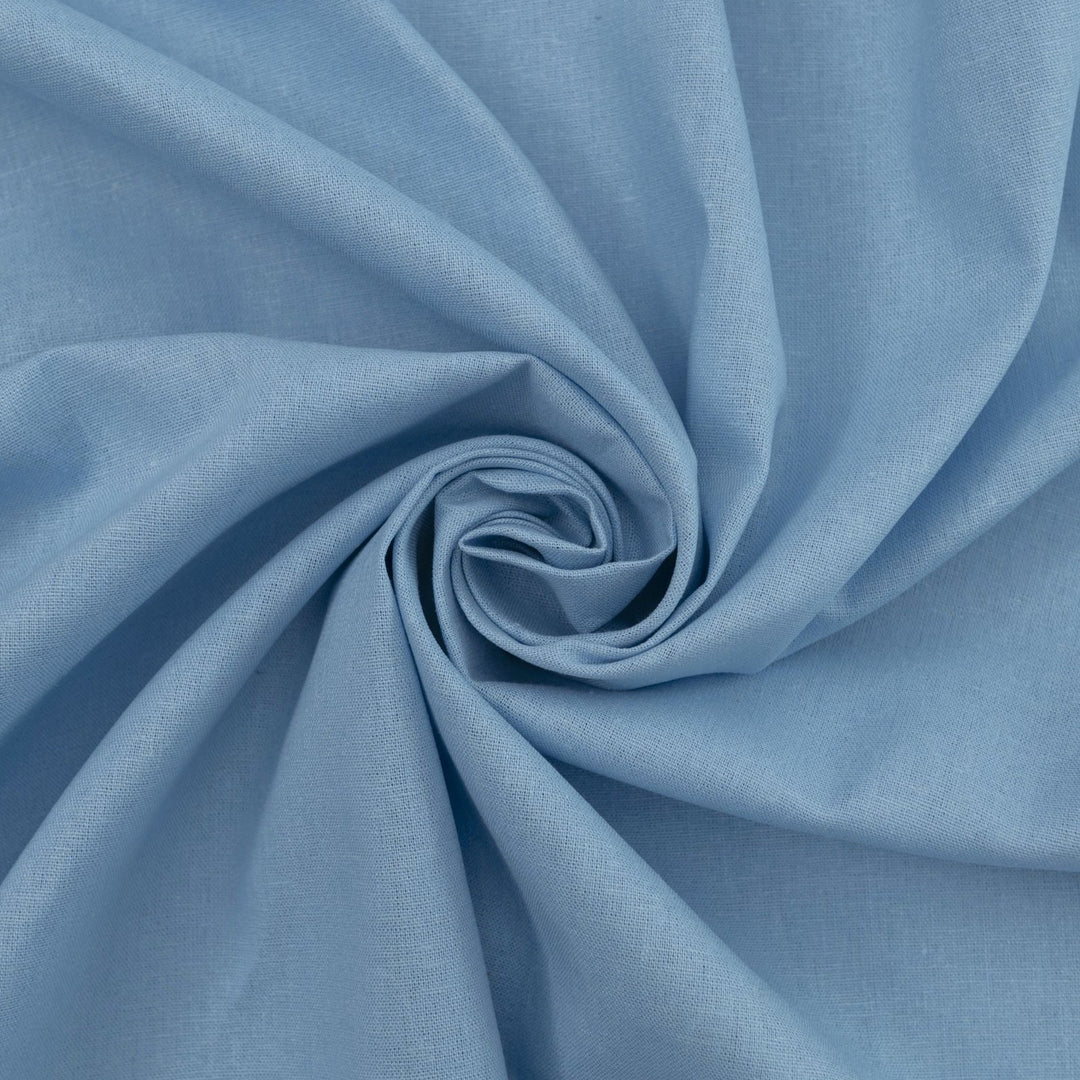 Pale blue linen and cotton blend fabric, mid-weight, soft, breathable, and opaque, perfect for sewing dresses, shirts, pants, and lightweight jackets.

