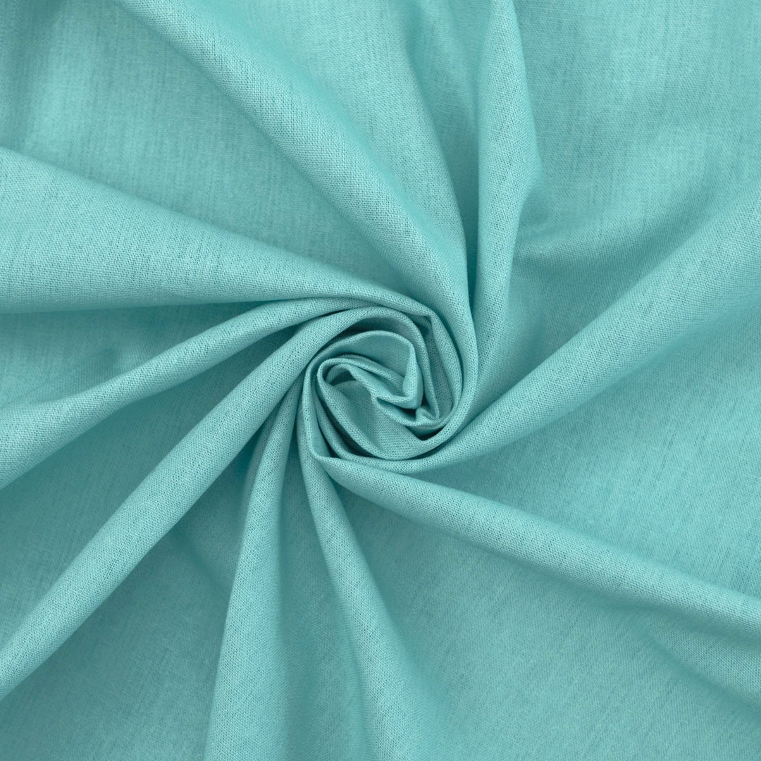 Pale jade linen and cotton blend fabric, mid-weight, soft, breathable, and opaque, ideal for sewing dresses, shirts, pants, and lightweight jackets.