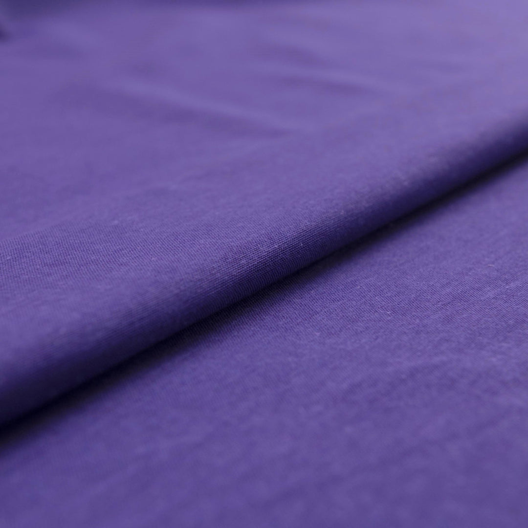 Royal purple linen and cotton blend fabric, mid-weight, soft, breathable, and opaque, ideal for sewing dresses, tunics, pants, shirts, and light jackets.

