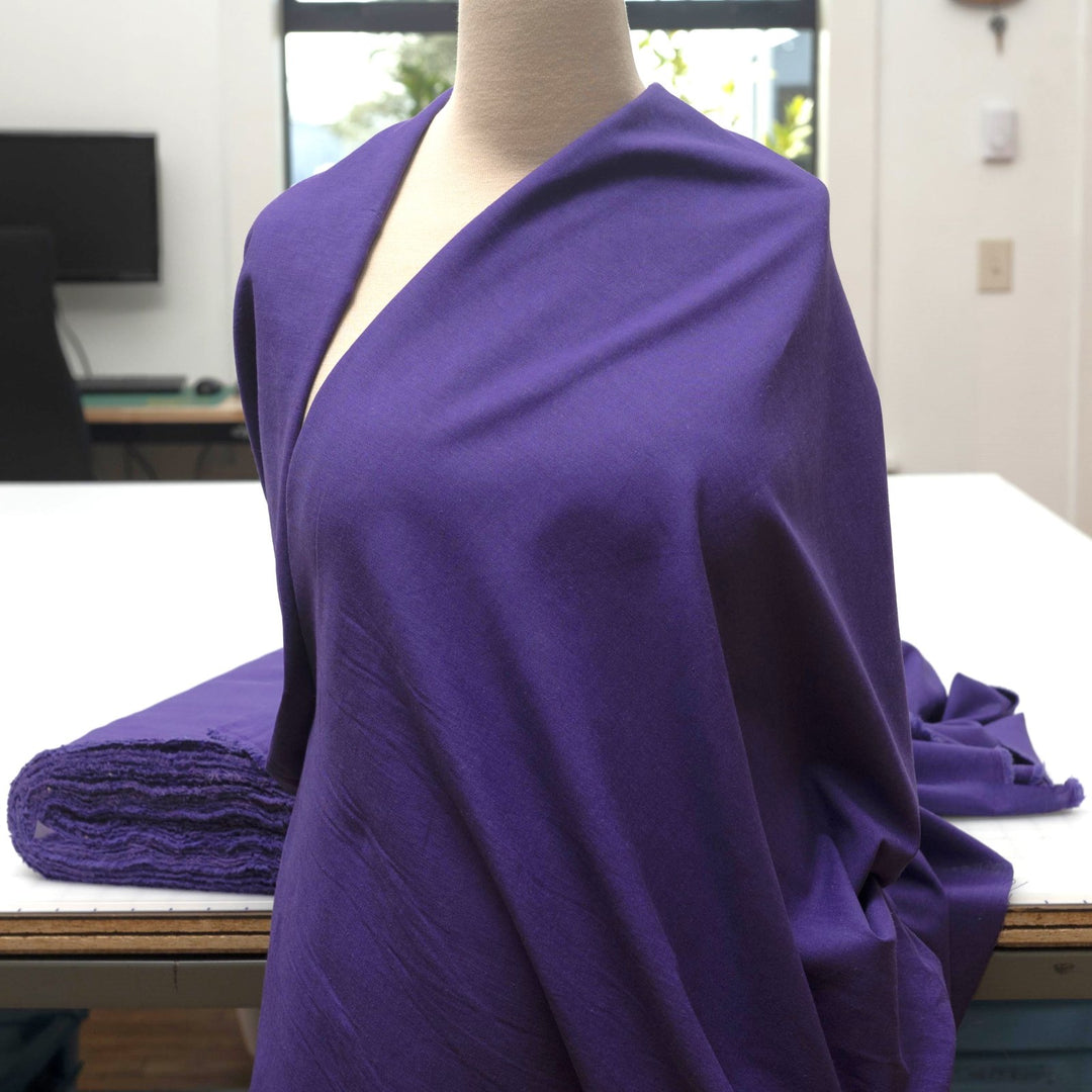 Royal purple linen and cotton blend fabric, mid-weight, soft, breathable, and opaque, ideal for sewing dresses, tunics, pants, shirts, and light jackets.


