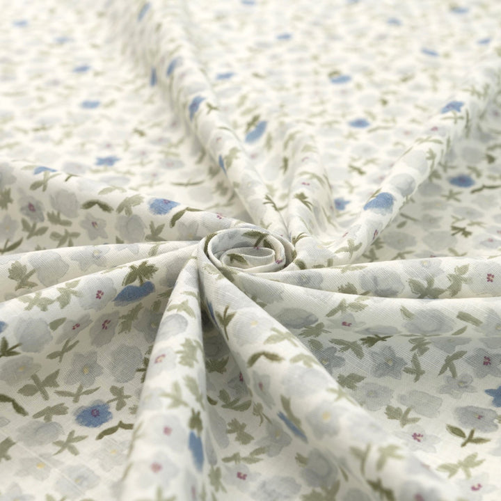 Linen and cotton blend fabric with soft blue floral pattern and green stems, 56-inch wide lightweight fabric