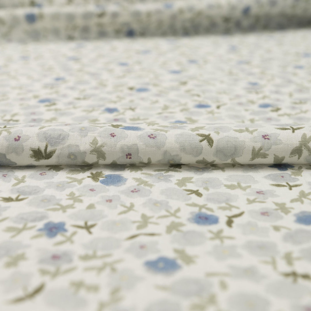 Linen and cotton blend fabric with soft blue floral pattern and green stems, 56-inch wide lightweight fabric