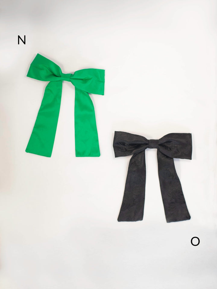 Handmade colorful classic hair bow on a barrette clip, perfect for all ages and occasions.