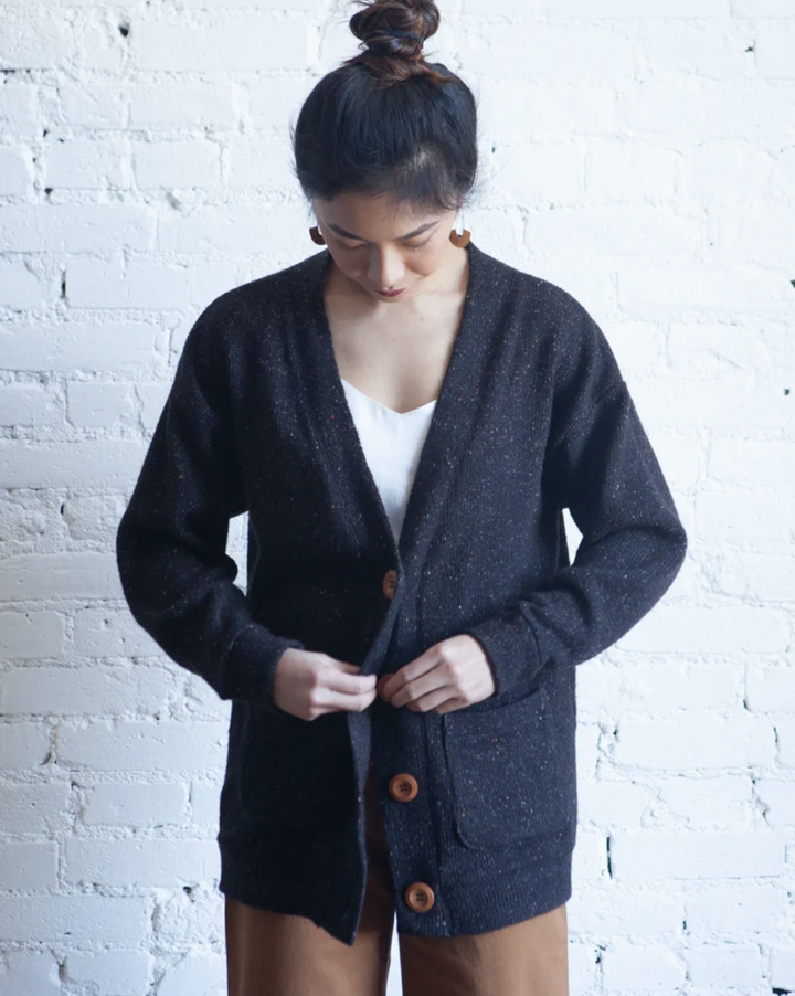 True Bias Marlo Sweater in medium-weight knit, featuring dropped shoulder, deep V-neck, wide bands, and large buttons, shown in cropped and mid-thigh length views.