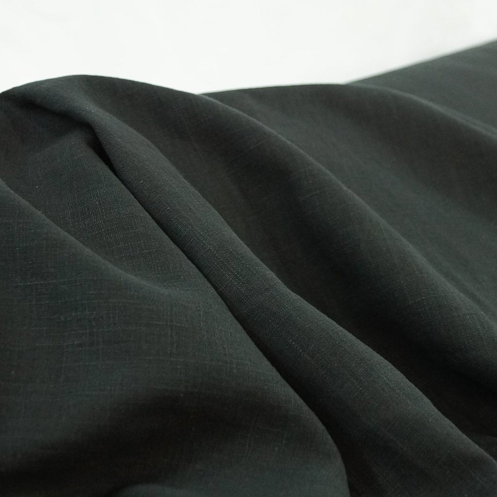 Luxurious soft wash black linen fabric for tailored jackets and dresses