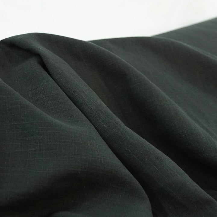 Luxurious soft wash black linen fabric for tailored jackets and dresses