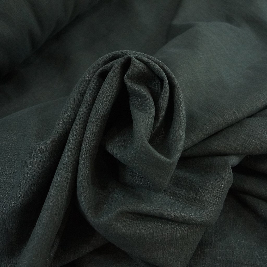 Luxurious soft wash black linen fabric for tailored jackets and dresses