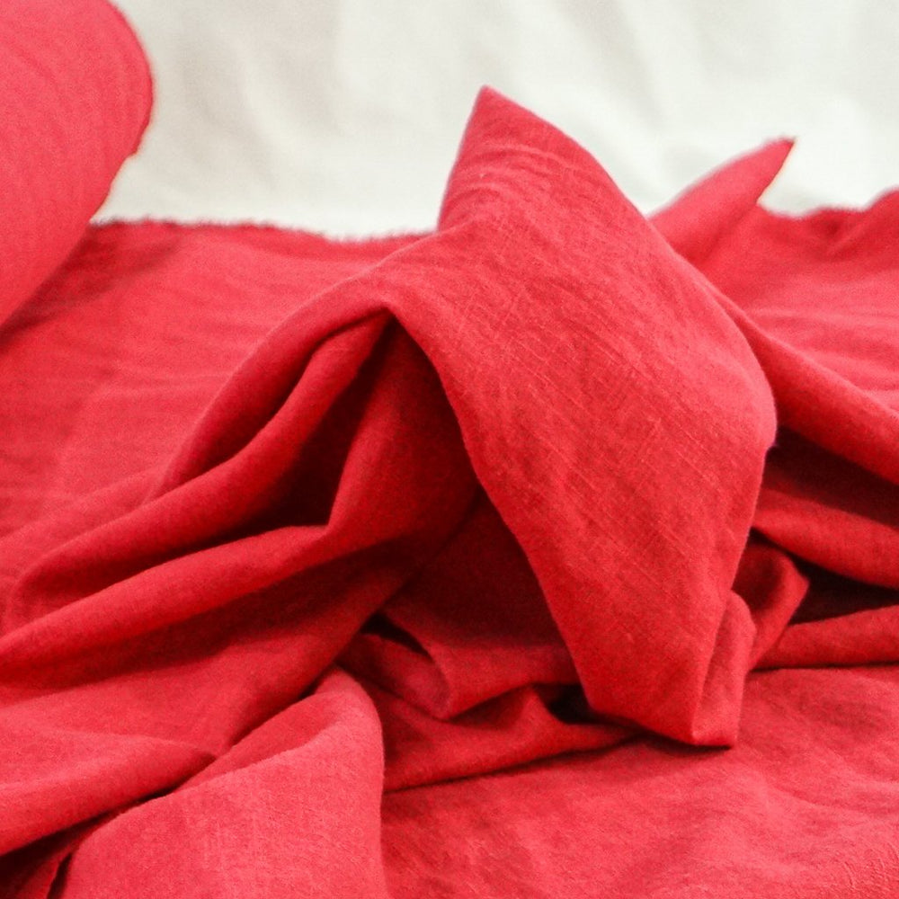 Soft Wash Linen in vibrant cayenne red color, 100% pre-washed linen fabric perfect for sewing dresses, jackets, and handmade garments.

