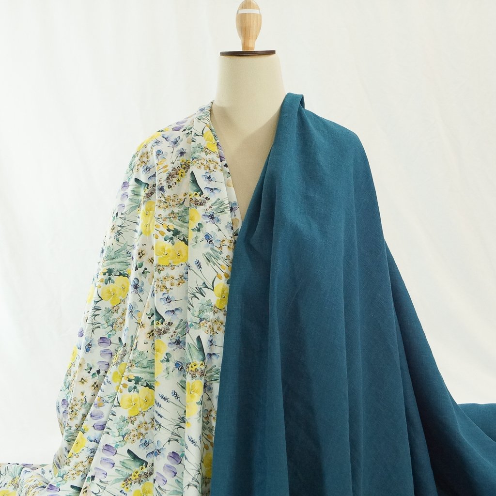 Soft Wash Linen fabric in vibrant marine blue color, 100% pre-washed linen ideal for sewing dresses, jackets, and lightweight garments.

