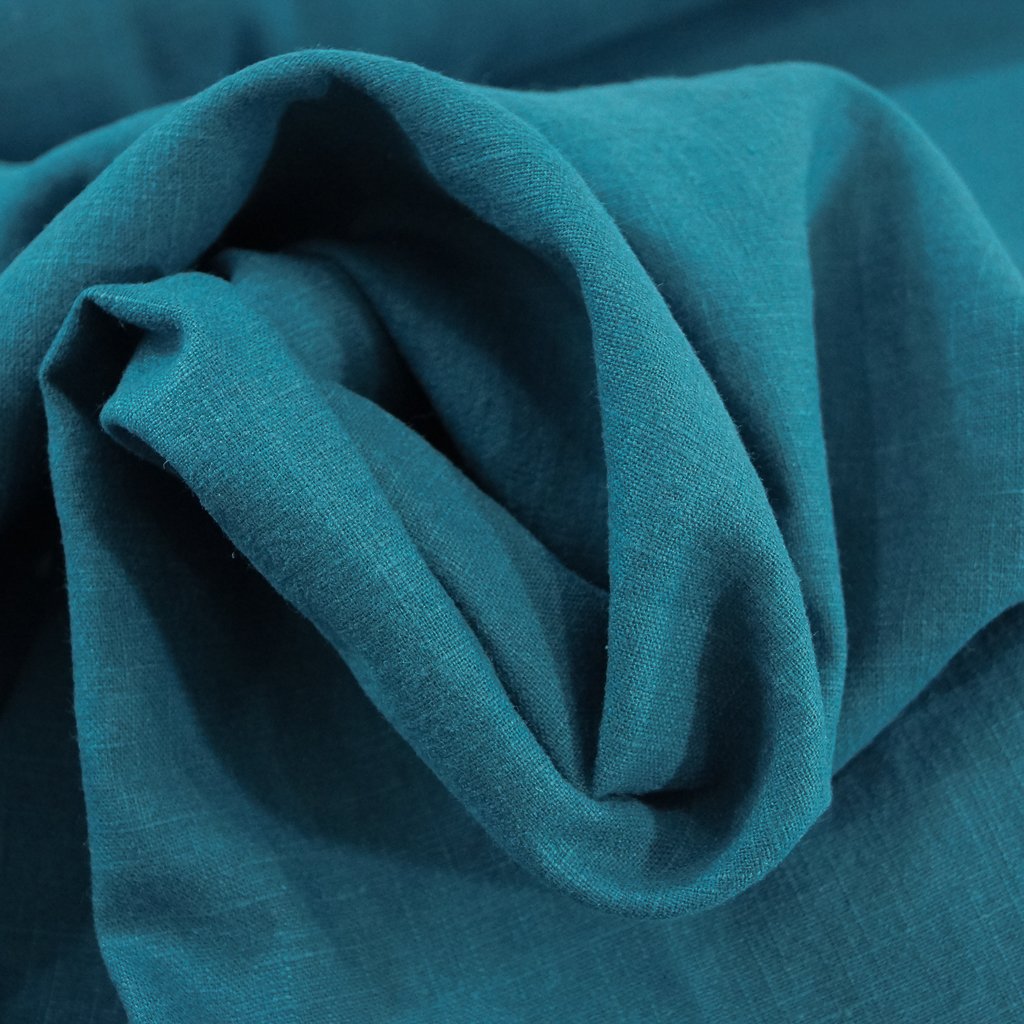 Soft Wash Linen fabric in vibrant marine blue color, 100% pre-washed linen ideal for sewing dresses, jackets, and lightweight garments.

