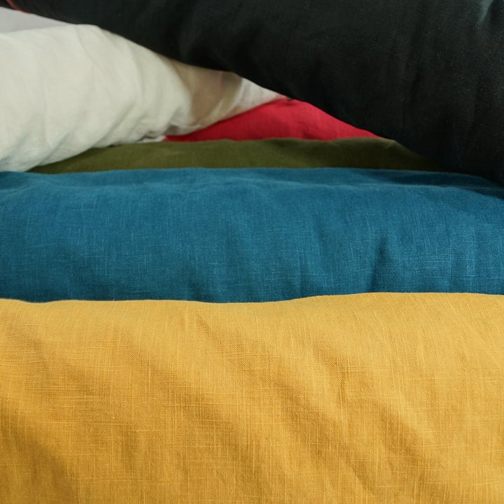 Soft Wash Linen fabric in rich olive green color, 100% pre-washed linen ideal for sewing dresses, jackets, pants, and more.

