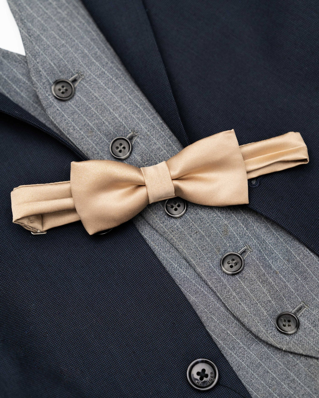Satin bowtie in elegant fall/winter hues, perfect for formal occasions.