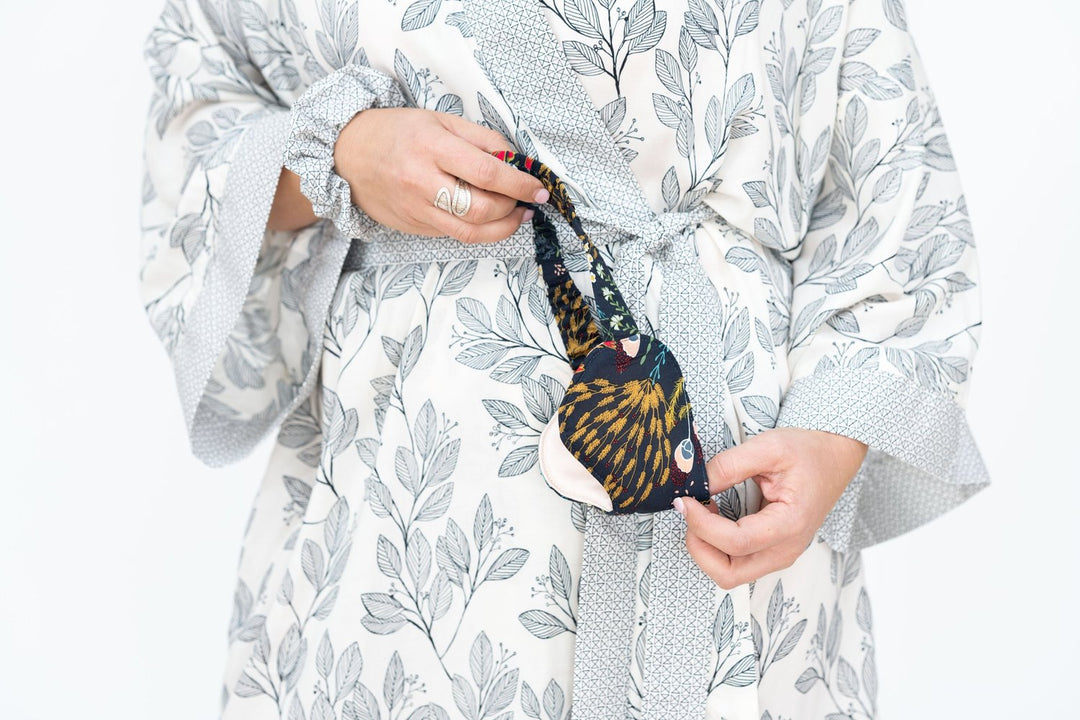 Luxurious silk satin sleep eyemask with soft elastic band for comfortable fit, paired with Signature robes.
