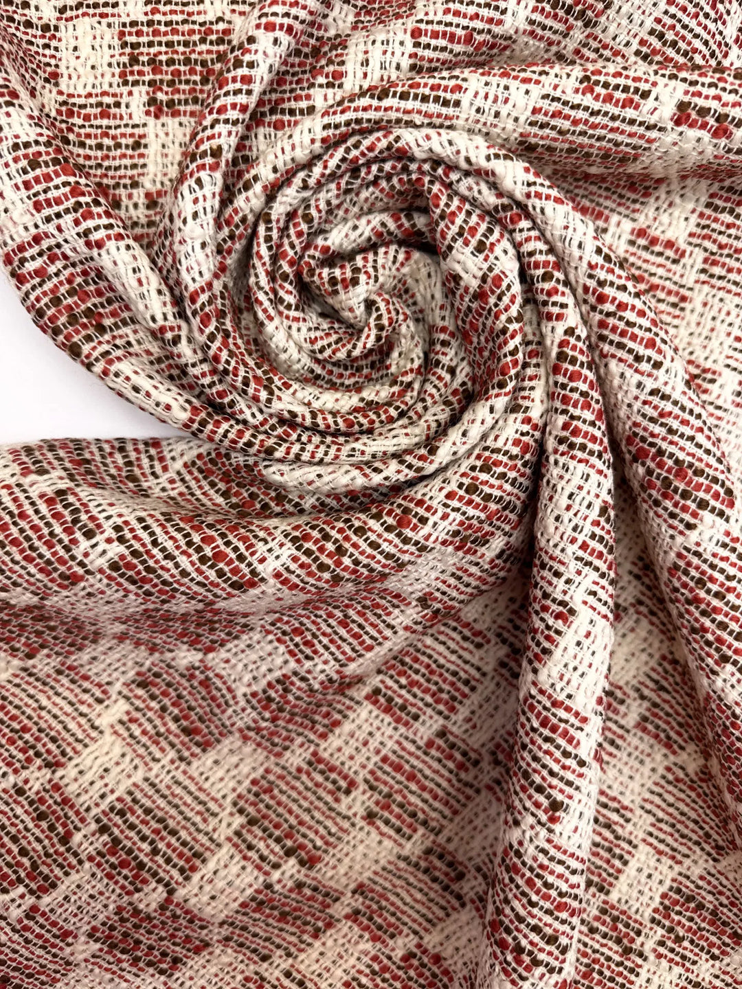 Premium Wool Boucle fabric in cream, red, and black cross-texture. Made from 85% Wool and 15% Cotton. Ideal for suiting, coats, and structured dresses.