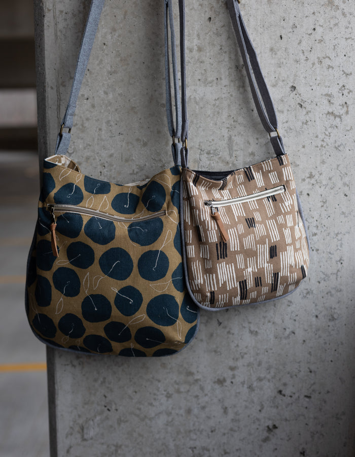 Noodlehead Trail Tote pattern with piping detail, zippered pocket, and adjustable crossbody strap