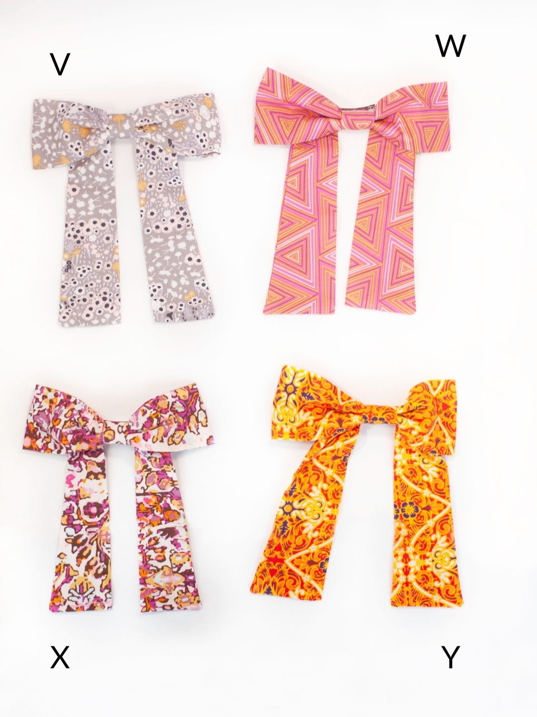 Handmade colorful classic hair bow on a barrette clip, perfect for all ages and occasions.