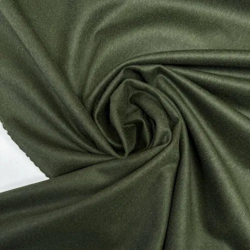Close-up of Wool Suiting fabric in green, made from 100% Italian wool, ideal for tailored suits, skirts, and structured dresses.