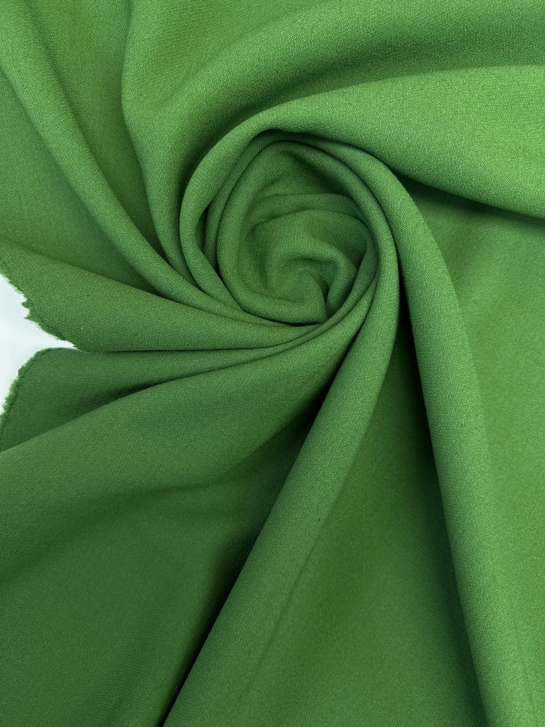 Luxurious Italian grass green wool twill fabric, perfect for coats, blazers, and suiting with strength, warmth, and timeless style.