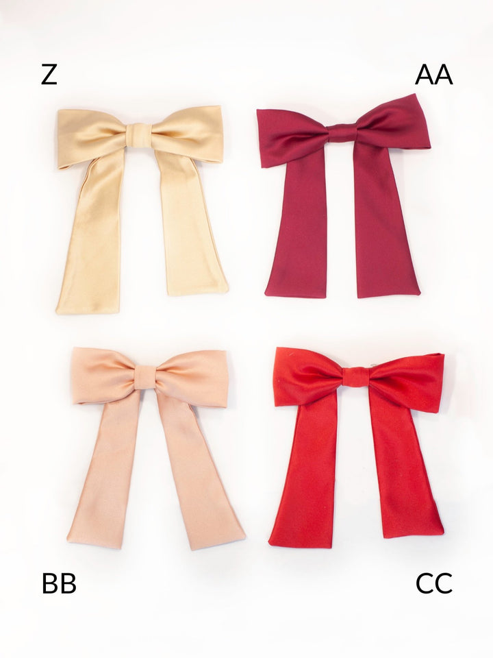 Handmade colorful classic hair bow on a barrette clip, perfect for all ages and occasions.