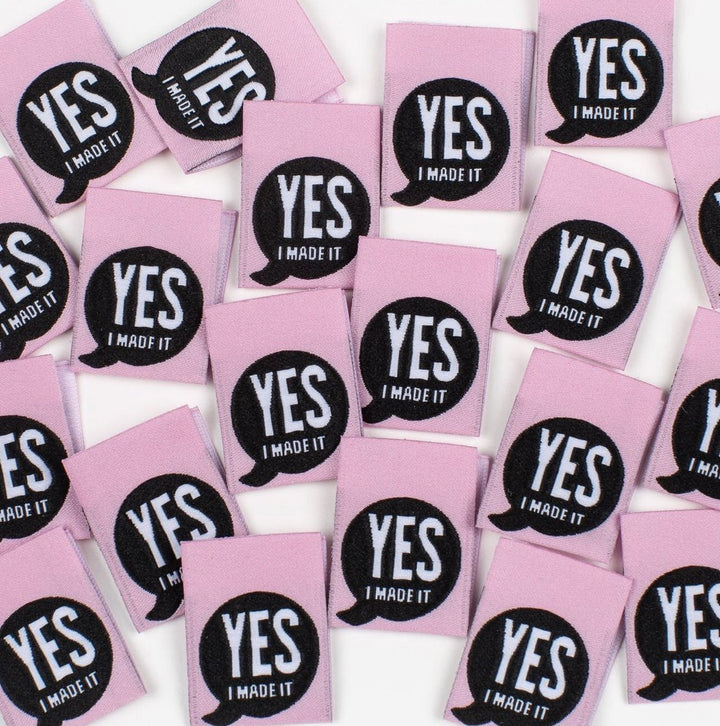 Bright pink 'Yes, I Made It' premium woven sewing labels for handmade garments and crafts