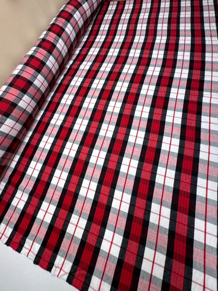 Italian cotton flannel fabric in large white, black, and red plaid, lightweight textile ideal for shirts, blouses, and casual wear.
