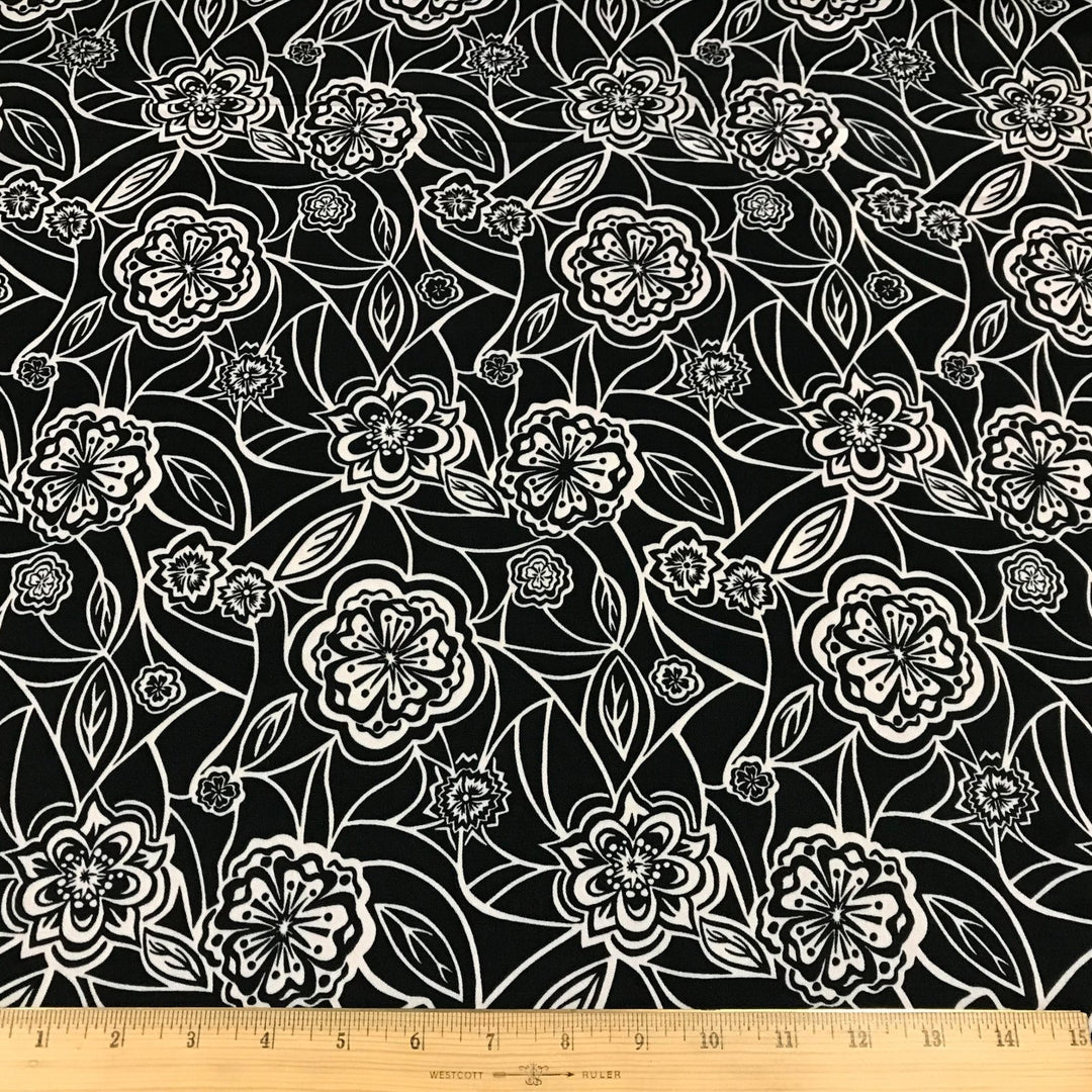 Organic Tencel Twill Rowdy Patch Black fabric with whimsical digital print, eco-friendly GOTS-certified inks, fluid drape, and luxury twill texture