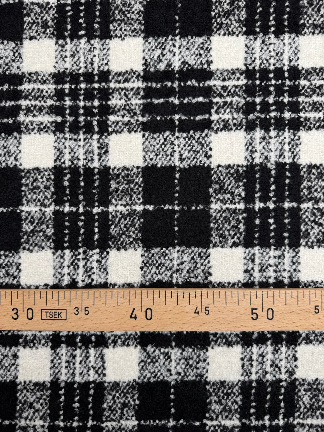 Black and white plaid tweed bouclé wool blend fabric, Italian twill weave, 55-inch wide, ideal for coats, jackets, skirts, and tailored suits