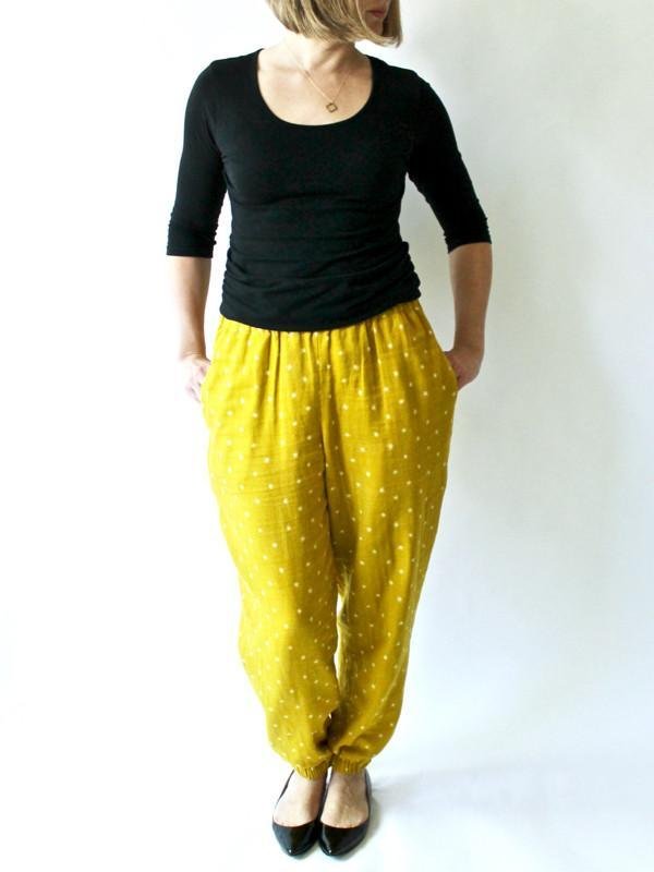 Made by Rae Luna Pants sewing pattern with tapered leg, inseam pockets, and loose comfortable fit in multiple fabrics