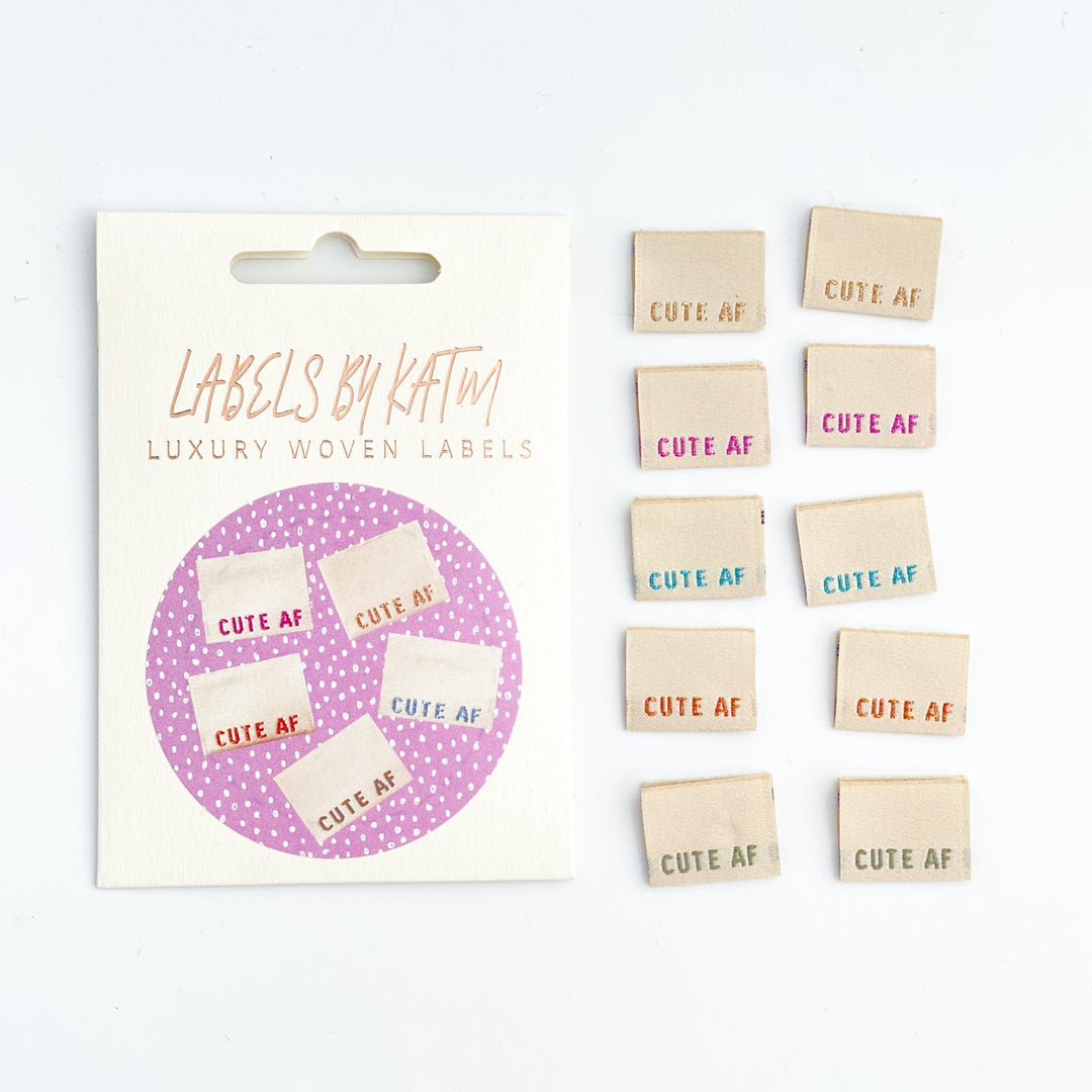 Playful 'Cute AF' woven sewing labels - premium quality garment tags for handmade clothing and crafts