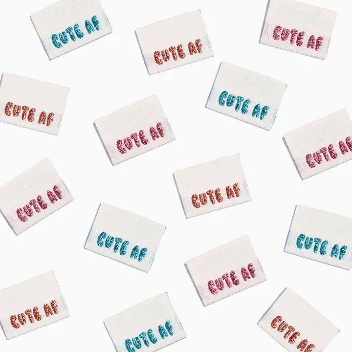 Sparkly Cute AF woven labels by Kylie and the Machine in turquoise, orange and pink - playful side seam tags for handmade creations
