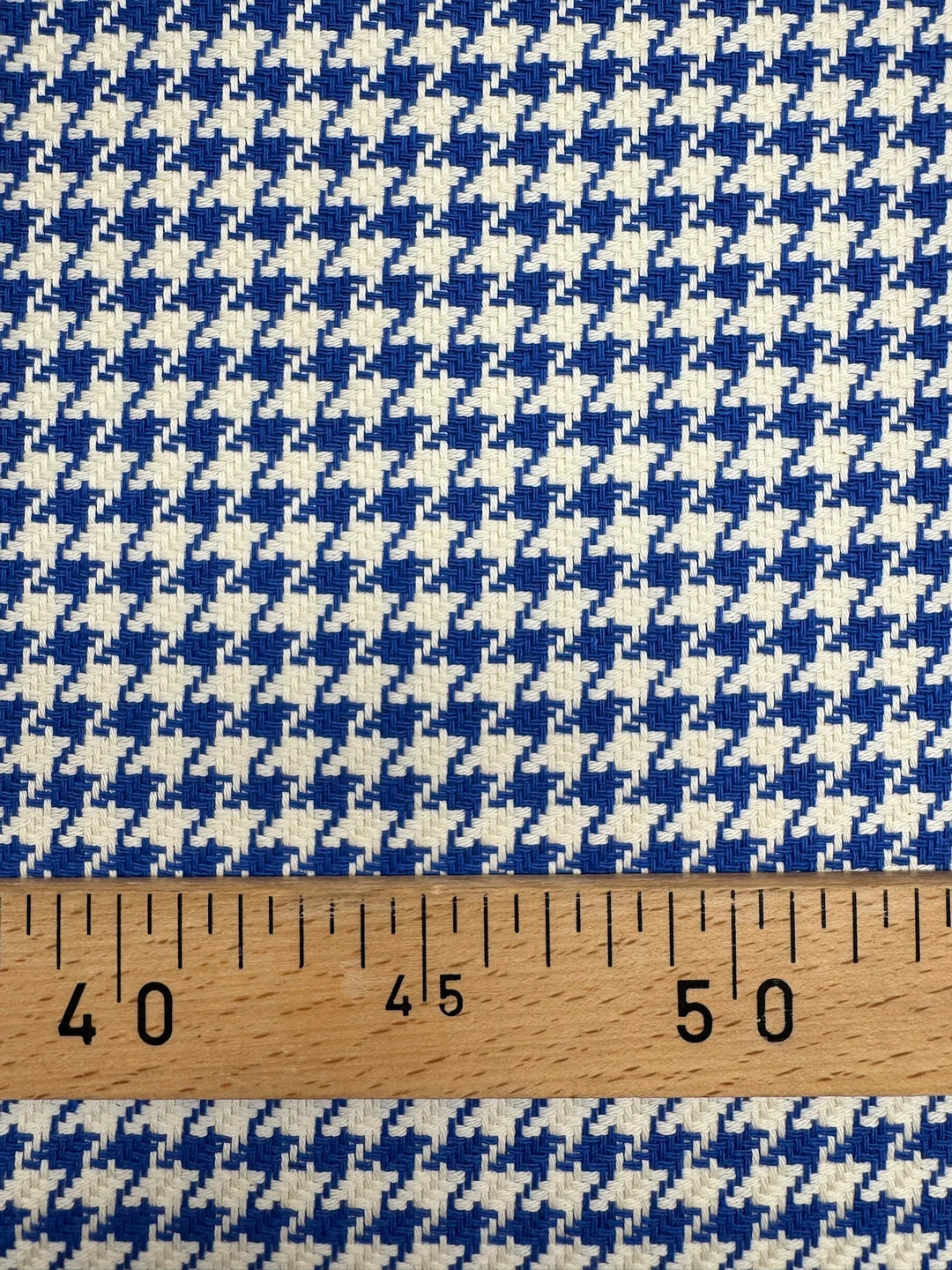 White and blue houndstooth tweed cotton blend fabric, Italian medium weight 61-inch wide, ideal for structured coats, dresses, skirts, and suits