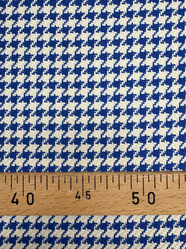 White and blue houndstooth tweed cotton blend fabric, Italian medium weight 61-inch wide, ideal for structured coats, dresses, skirts, and suits