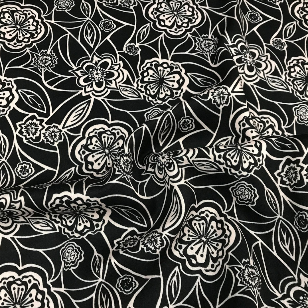 Organic Tencel Twill Rowdy Patch Black fabric with whimsical digital print, eco-friendly GOTS-certified inks, fluid drape, and luxury twill texture