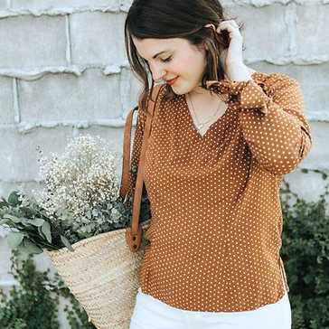 Sew to Grow Seoul Blossom Blouse with V-neck, curved back hem, side slits, and optional bow cuff.
