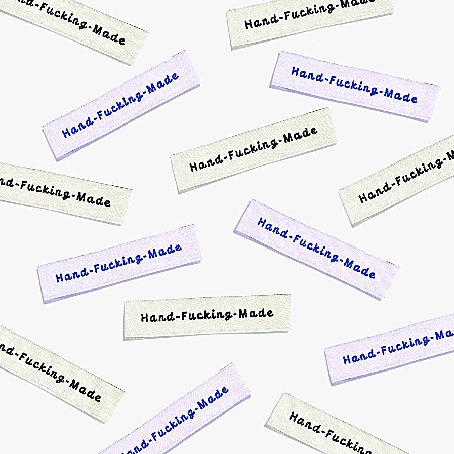Kylie and the Machine 'Hand Fcking Made' woven labels in cream/black and lilac/blue – playful sewing labels for proud makers