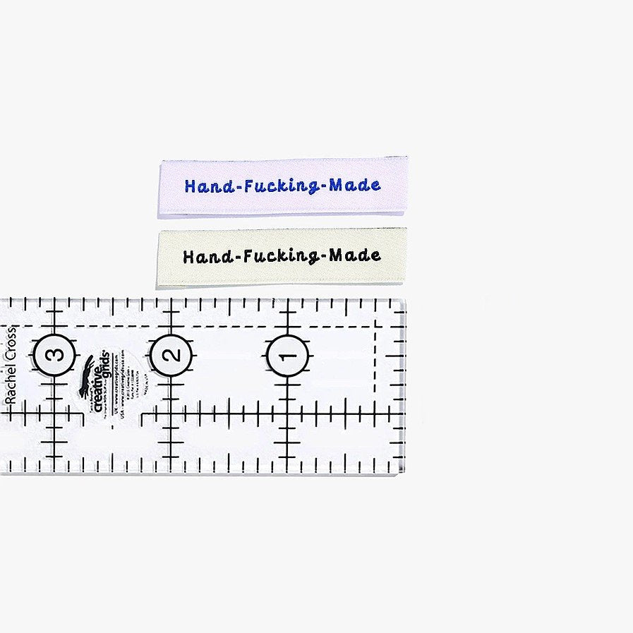 Kylie and the Machine 'Hand Fcking Made' woven labels in cream/black and lilac/blue – playful sewing labels for proud makers