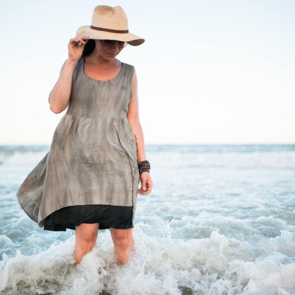 Sew Liberated Metamorphic Dress sewing pattern with reversible design, high/low waist seam, tiered skirt with patch pockets, and pinafore option