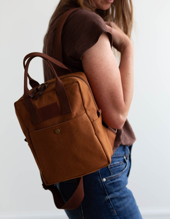 Noodlehead Making Backpack pattern in regular and mini sizes with customizable fabrics and pockets