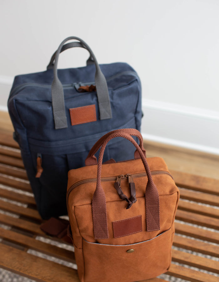 Noodlehead Making Backpack pattern in regular and mini sizes with customizable fabrics and pockets