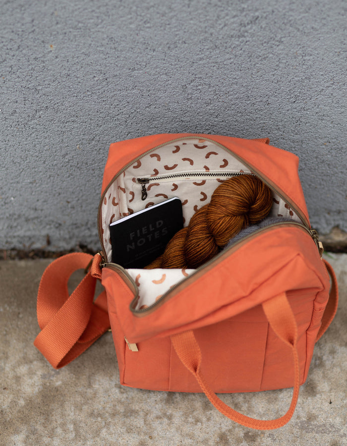 Noodlehead Making Backpack pattern in regular and mini sizes with customizable fabrics and pockets