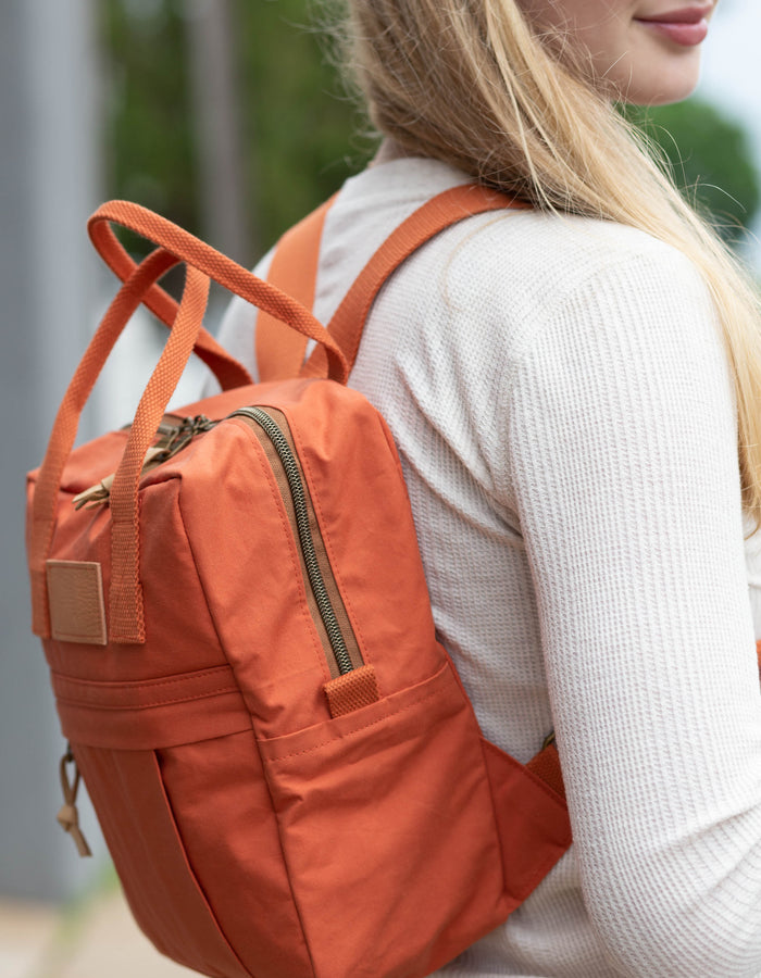 Noodlehead Making Backpack pattern in regular and mini sizes with customizable fabrics and pockets