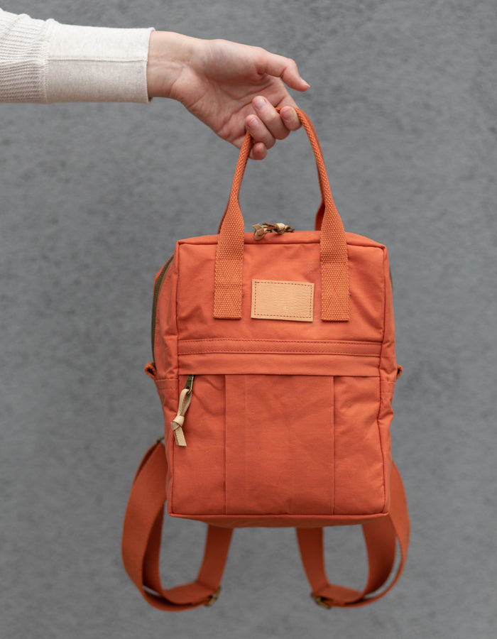 Noodlehead Making Backpack pattern in regular and mini sizes with customizable fabrics and pockets