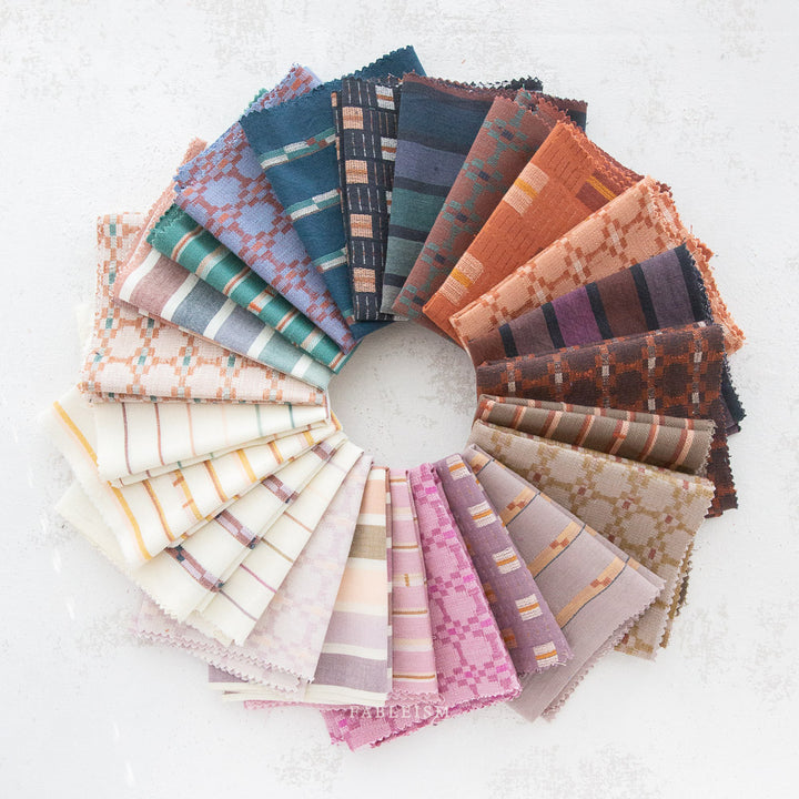 Cotton woven fabric in monarch grove design with blue and rust tones – 100% cotton material for shirts, blouses, dresses, and skirts.