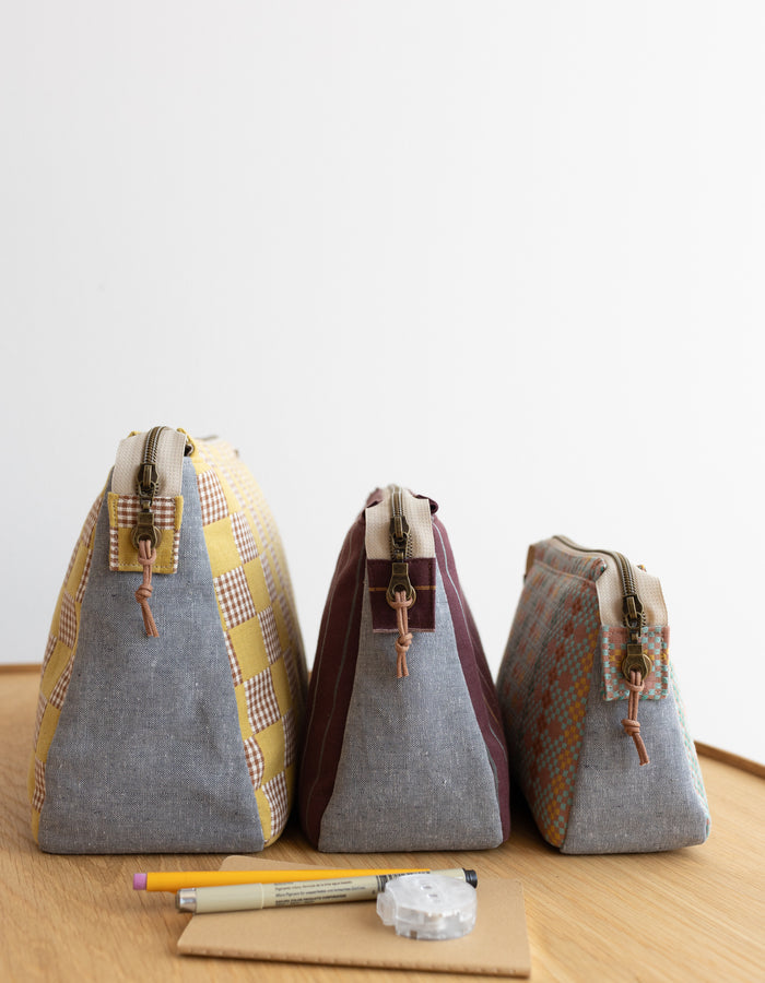 Noodlehead Plover Pouch pattern in three sizes with mesh pocket, zippered compartments, and snap detail