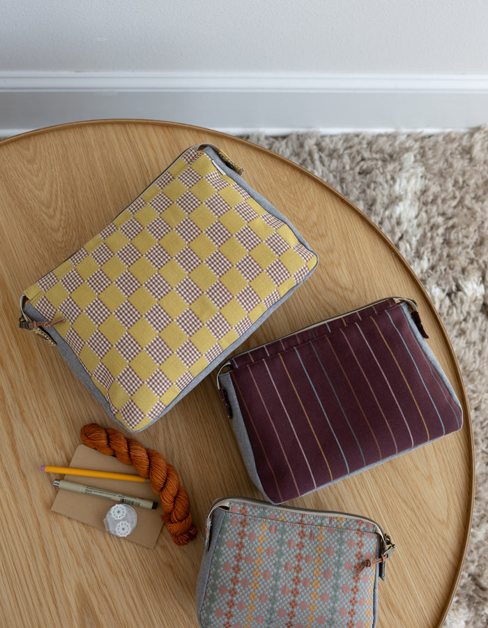 Noodlehead Plover Pouch pattern in three sizes with mesh pocket, zippered compartments, and snap detail