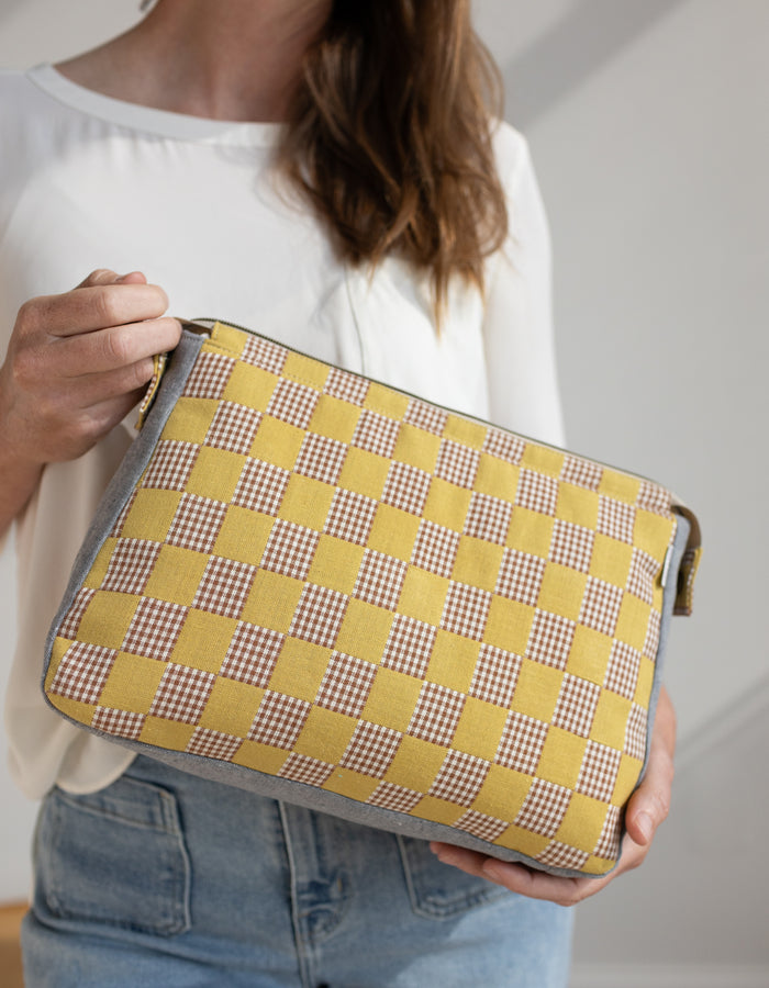 Noodlehead Plover Pouch pattern in three sizes with mesh pocket, zippered compartments, and snap detail